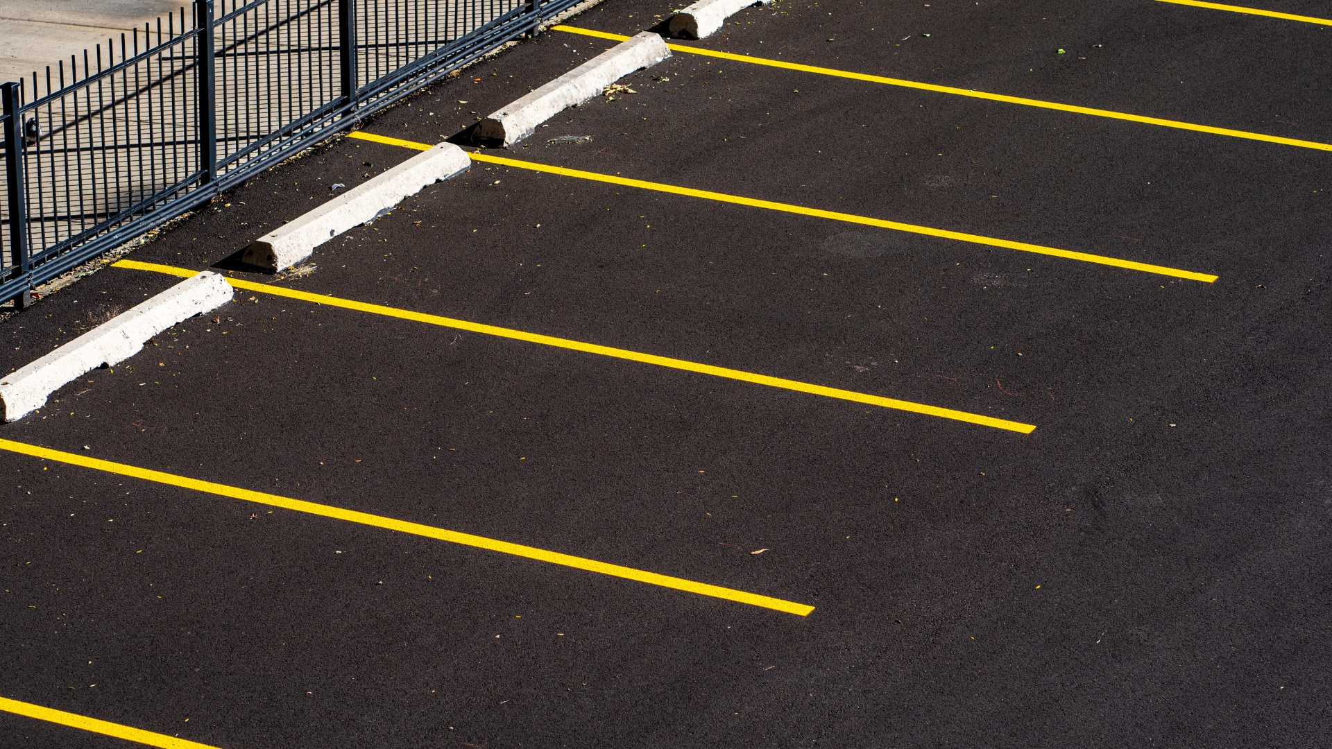 A parking lot with yellow lines painted on it